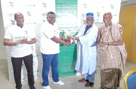 Chief Executive of Eco Index Solutions, Dr. Francis Akuamoah Boateng, second from left, in a symbolic launch of the product with Alhaji Alhassan Bukari, second from right