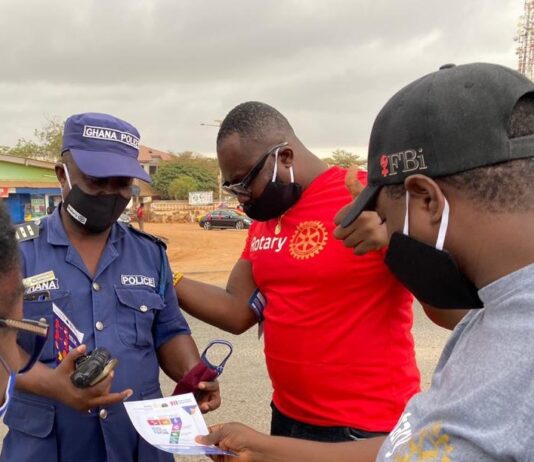 Rotary Club of Tema Community 25 shares nose masks at Old Ningo Market Square
